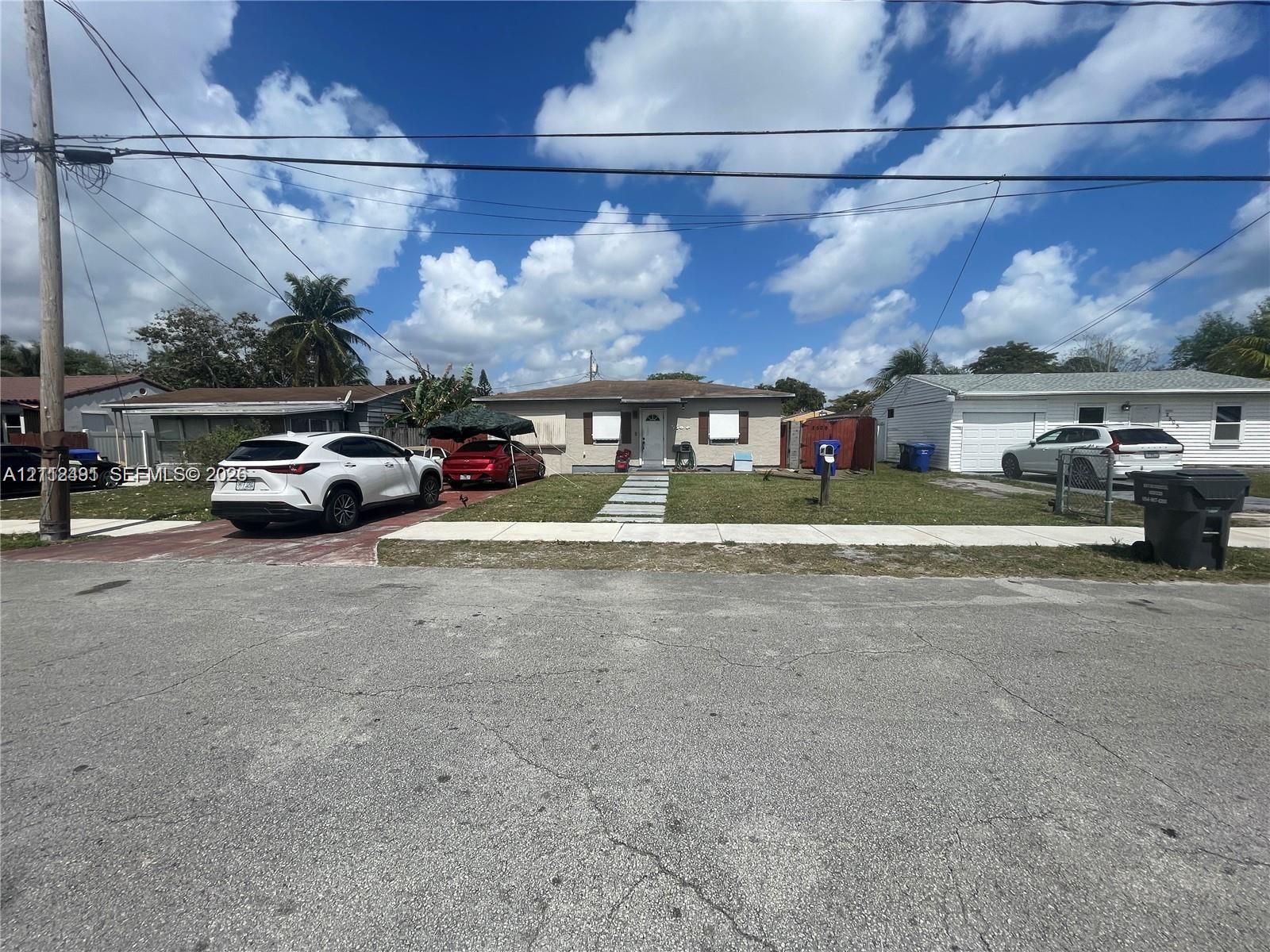 Single-story residence featuring light-toned masonry exterior, concrete paver walkway, and attached one-car garage Single-story residence featuring light-toned masonry exterior, concrete paver walkway, and attached one-car garage
