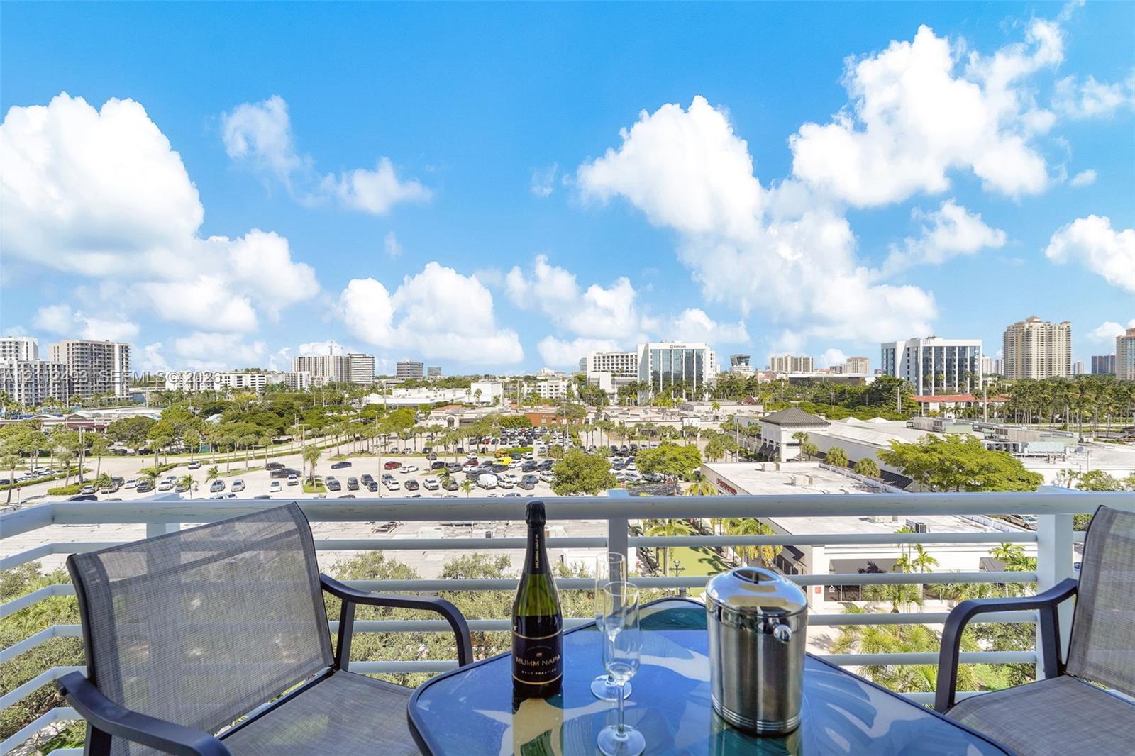 Balcony featuring white metal railings and expansive exterior surroundings