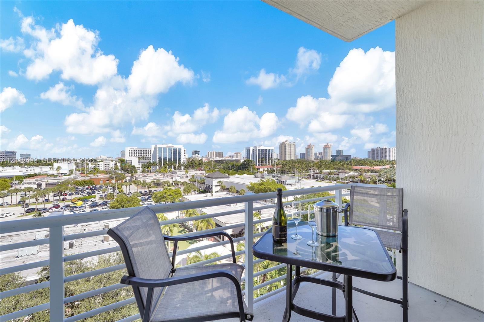 Private balcony featuring a metal railing and concrete flooring