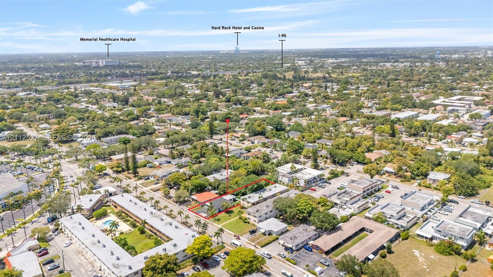 Aerial view of property lot featuring mature landscaping and proximity to major regional thoroughfares and area institutions