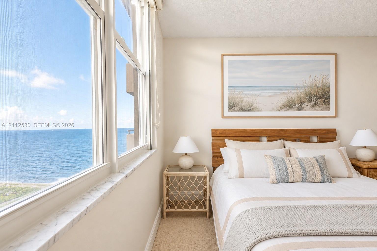 Floor-to-ceiling windows featuring stone sills and expansive ocean scenery