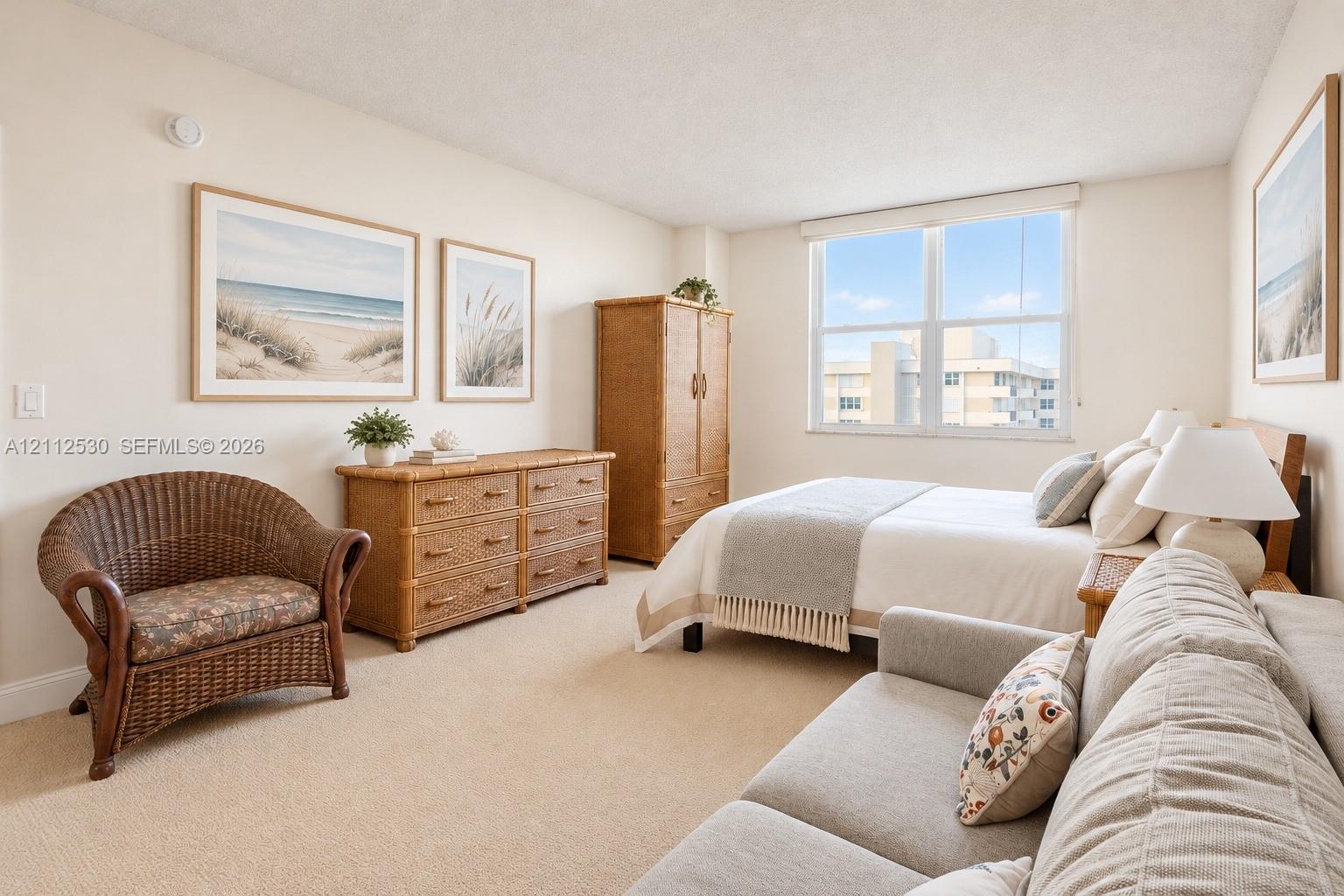 Neutral-toned carpeted flooring, large-format dual-pane window, and textured wall finish