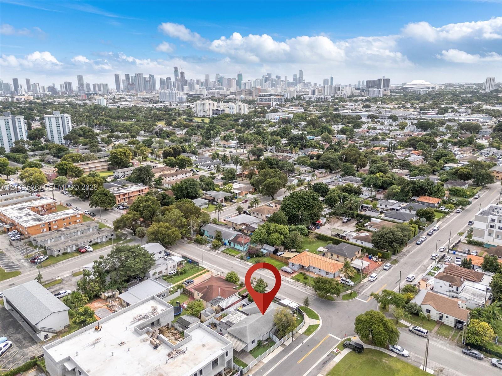 Aerial perspective featuring a corner lot orientation and proximity to the metropolitan skyline
