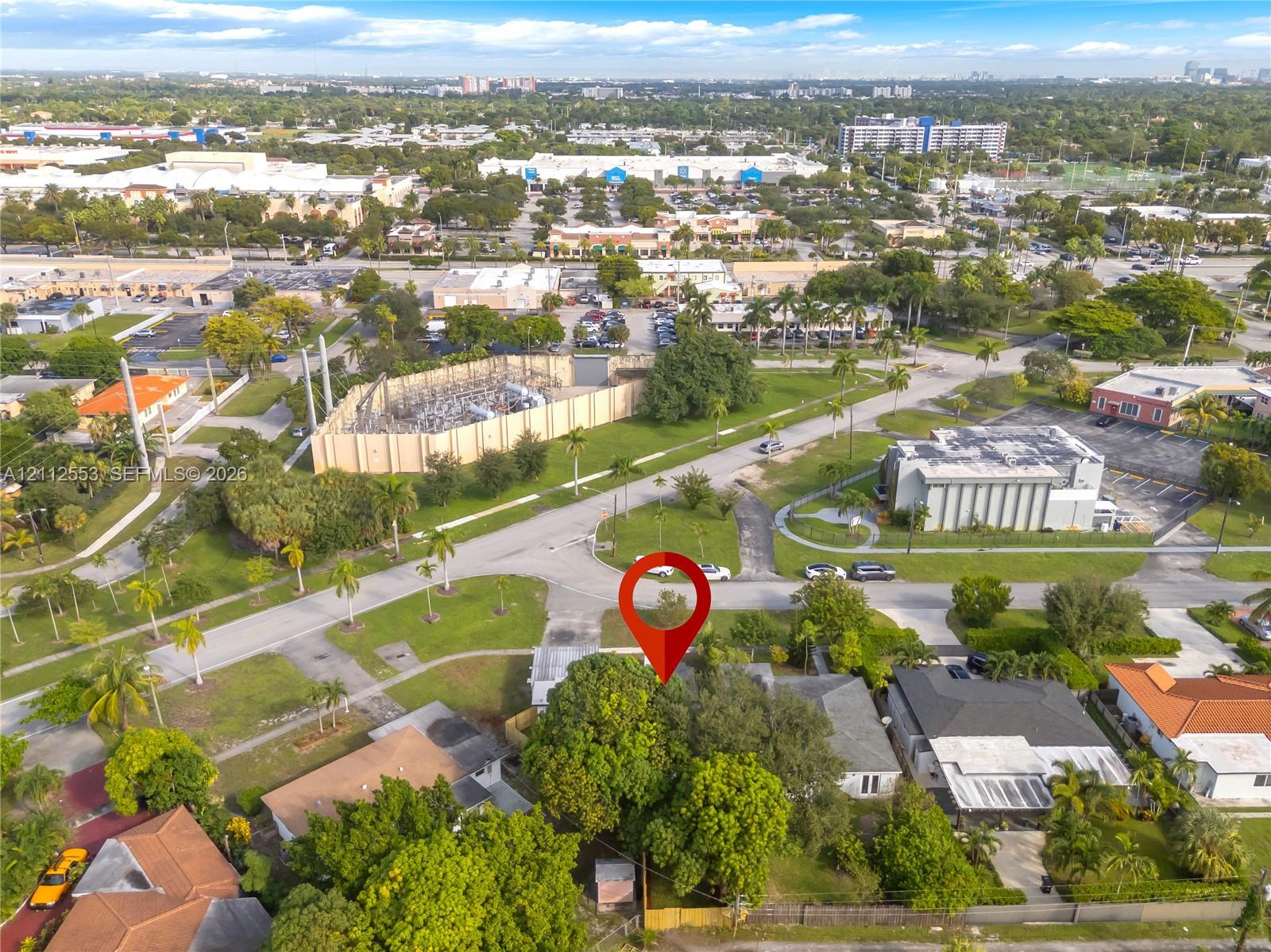 Aerial perspective of a parcel featuring established tree coverage and expansive green space