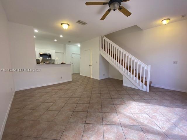 Ceramic tile flooring, open kitchen featuring a breakfast bar, recessed ceiling lighting