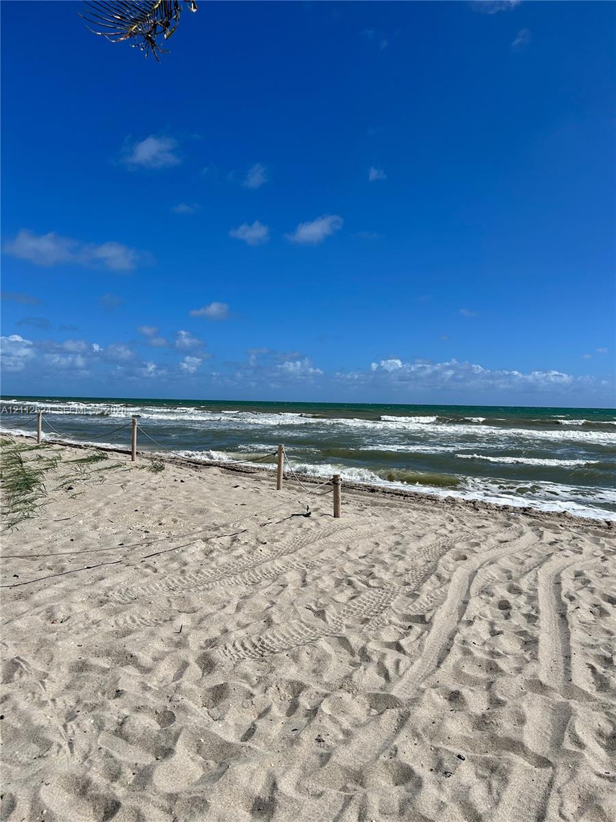 Sandy shoreline featuring a timber post and rope perimeter fencing