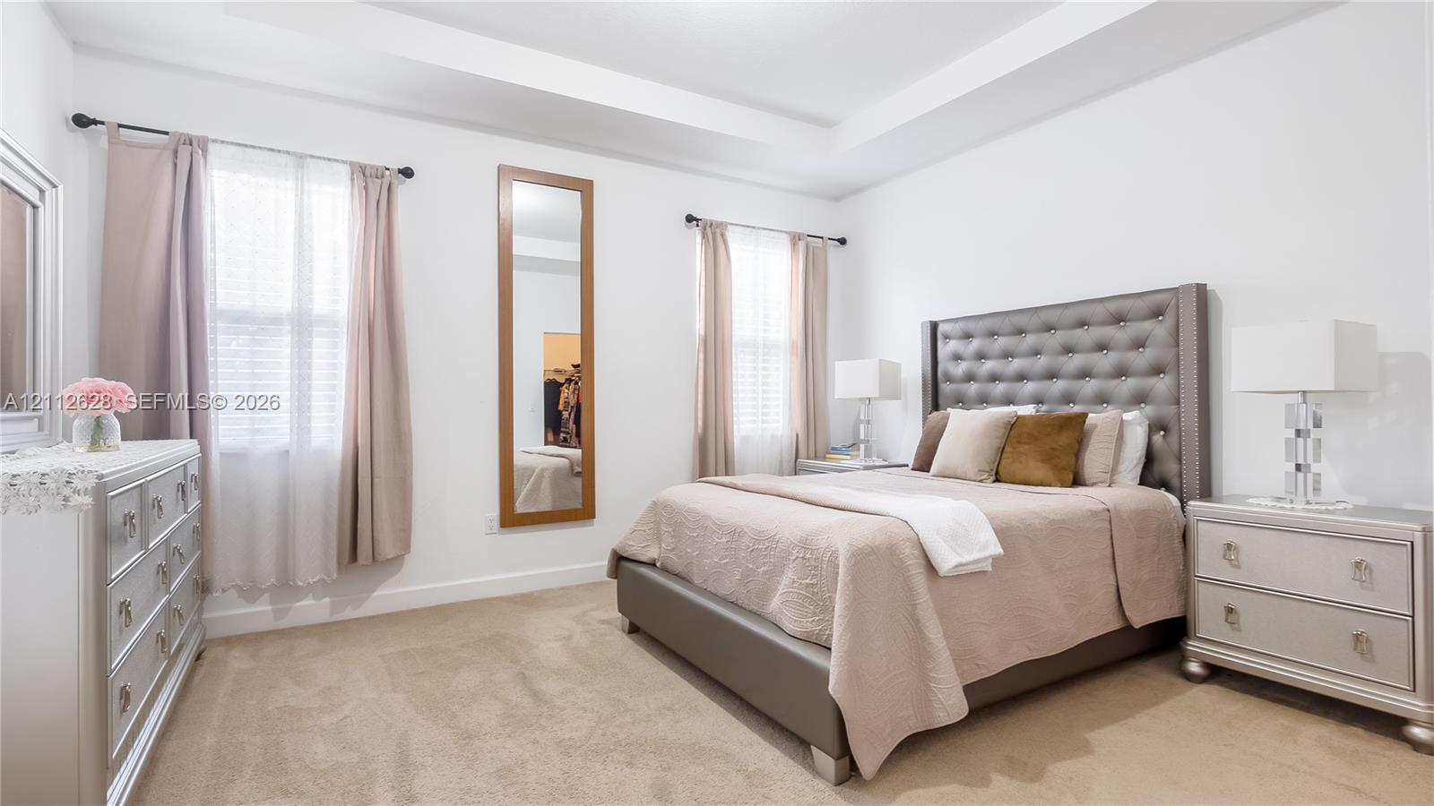Retreat to a bright and spacious primary suite featuring elegant tray ceilings, abundant natural light, and a serene ambiancecomplete with a generous walk-in closet and an oversized ensuite bathroom for the ultimate everyday luxury
