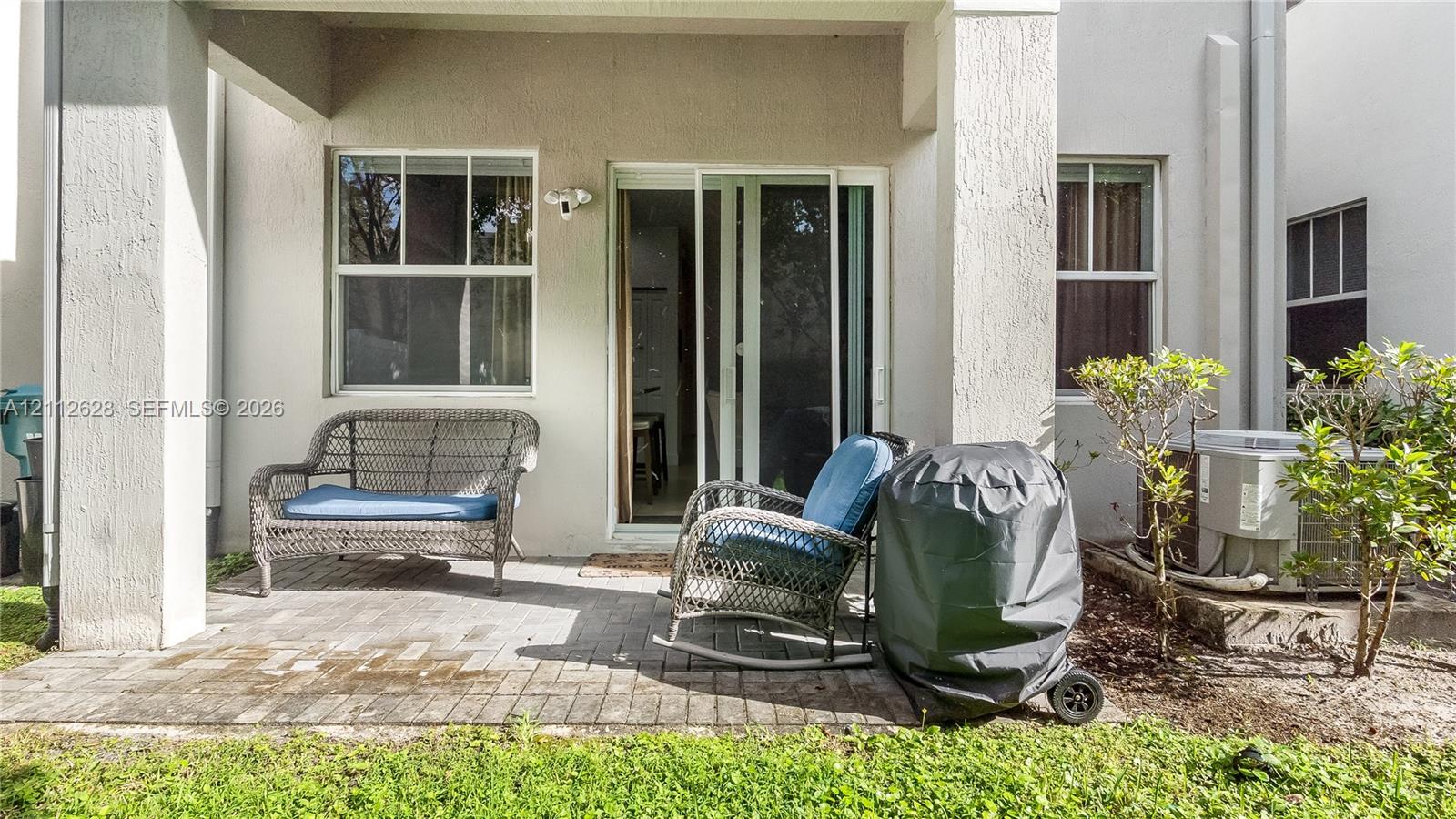 A peaceful, tree-lined backyard offering a private outdoor escapeperfect for unwinding, enjoying morning coffee, or creating a cozy lounge or play area to suit your lifestyle.