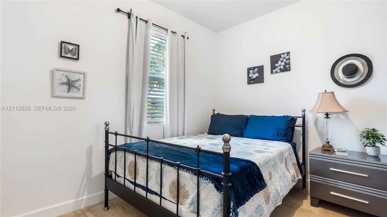 This inviting guest bedroom provides soft natural light, generous wall space, and a cozy atmosphereperfect for restful nights or flexible use to suit your lifestyle.