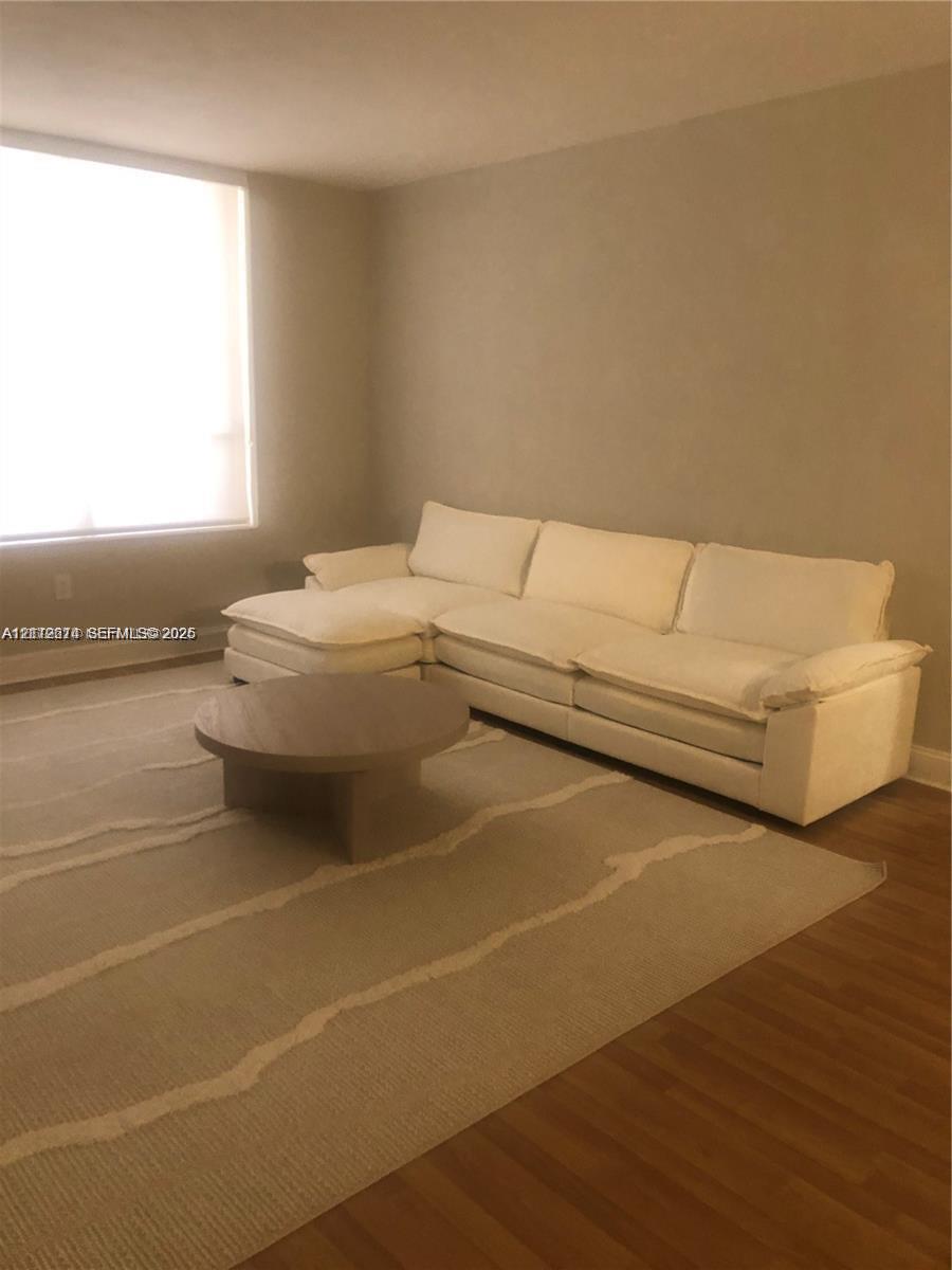 Wood-finish flooring and large-scale vertical window Wood-finish flooring and large-scale vertical window