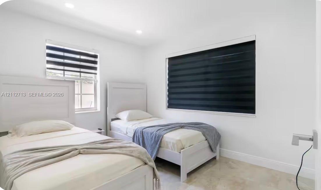 Neutral-toned interior featuring recessed lighting, dual-pane windows, and light-toned tile flooring throughout