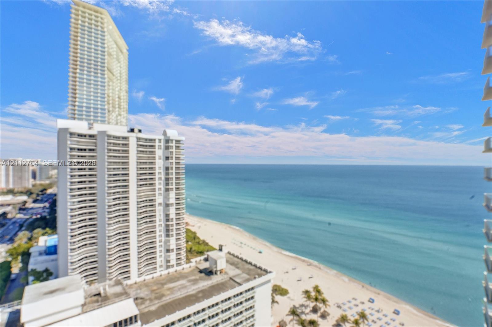 High-rise exterior architecture with expansive coastal and ocean scenery