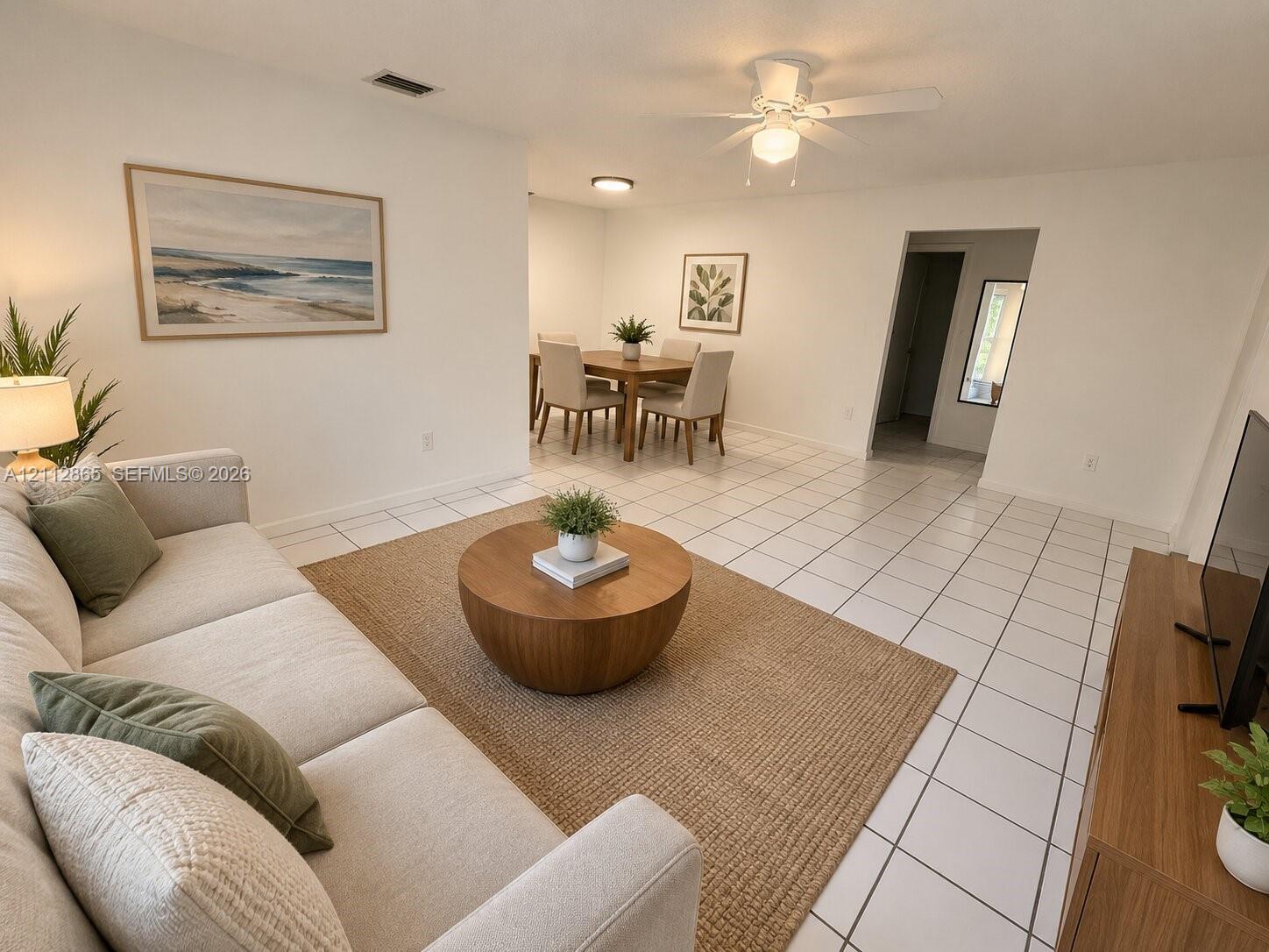 Ceramic tile flooring, neutral wall finishes, and a ceiling fan with integrated lighting Ceramic tile flooring, neutral wall finishes, and a ceiling fan with integrated lighting