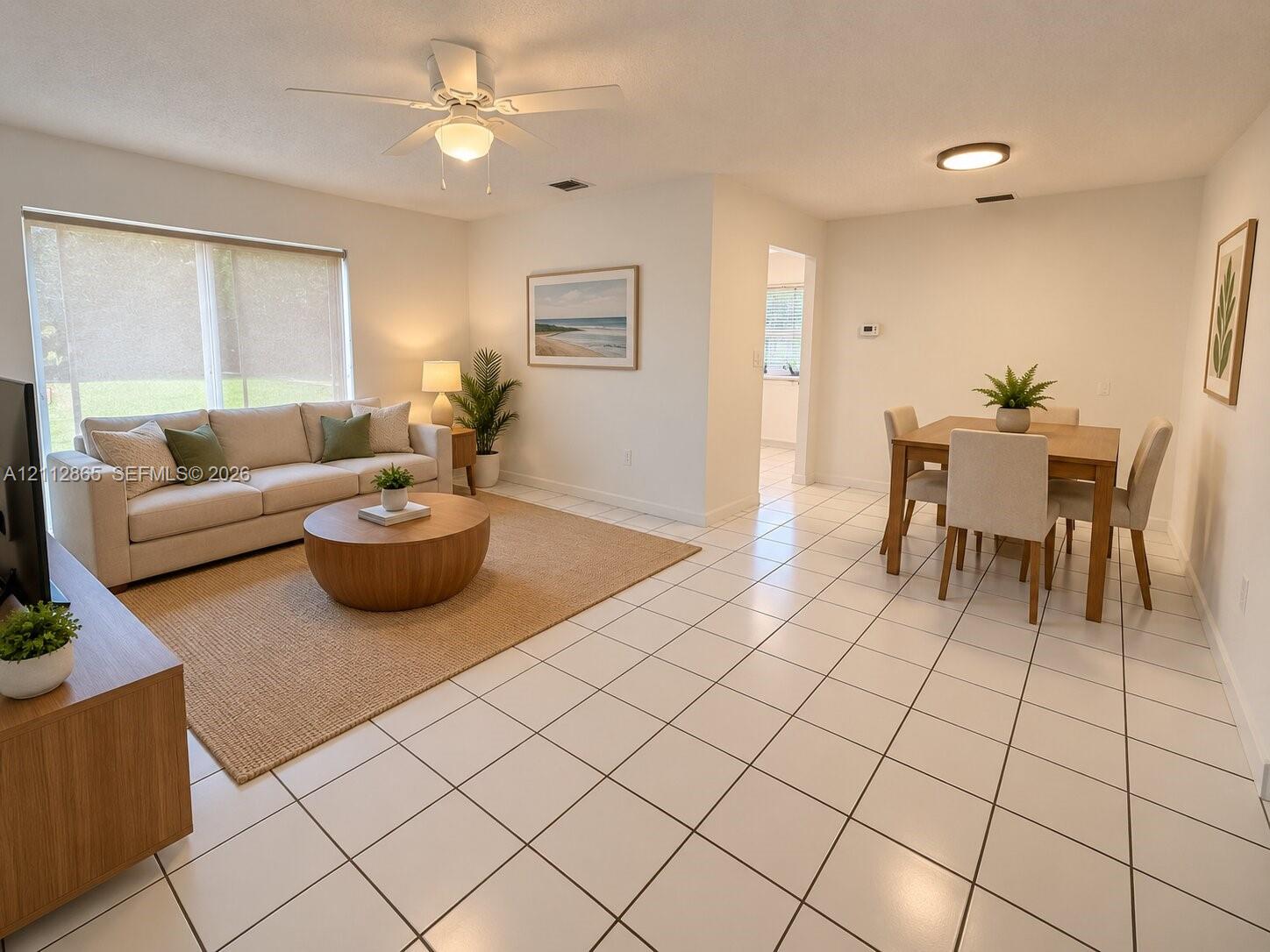Ceramic tile flooring, white-finish ceiling fan, neutral wall color, and flush-mount lighting