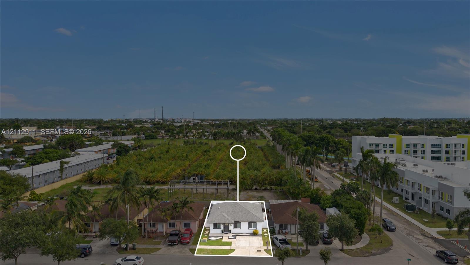 Single-story residence featuring a hip roof, concrete driveway, and front lawn