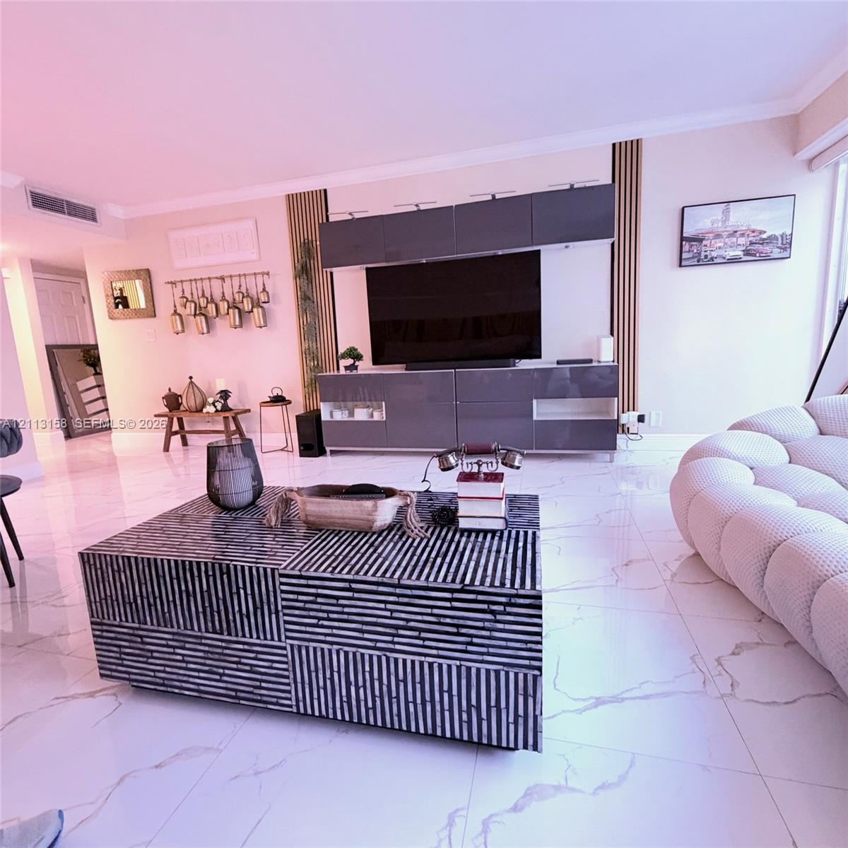 Large-format stone-look tile flooring with grey veining, built-in grey high-gloss cabinetry, and vertical wood-slat accent paneling Large-format stone-look tile flooring with grey veining, built-in grey high-gloss cabinetry, and vertical wood-slat accent paneling