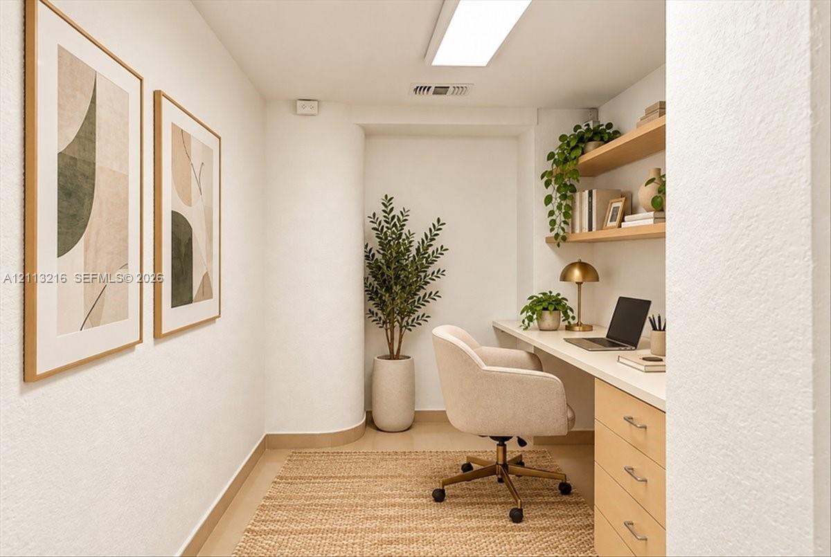 Built-in wooden desk featuring a seamless countertop and integrated storage cabinetry, complemented by tiered floating wood shelving and smooth-finish walls