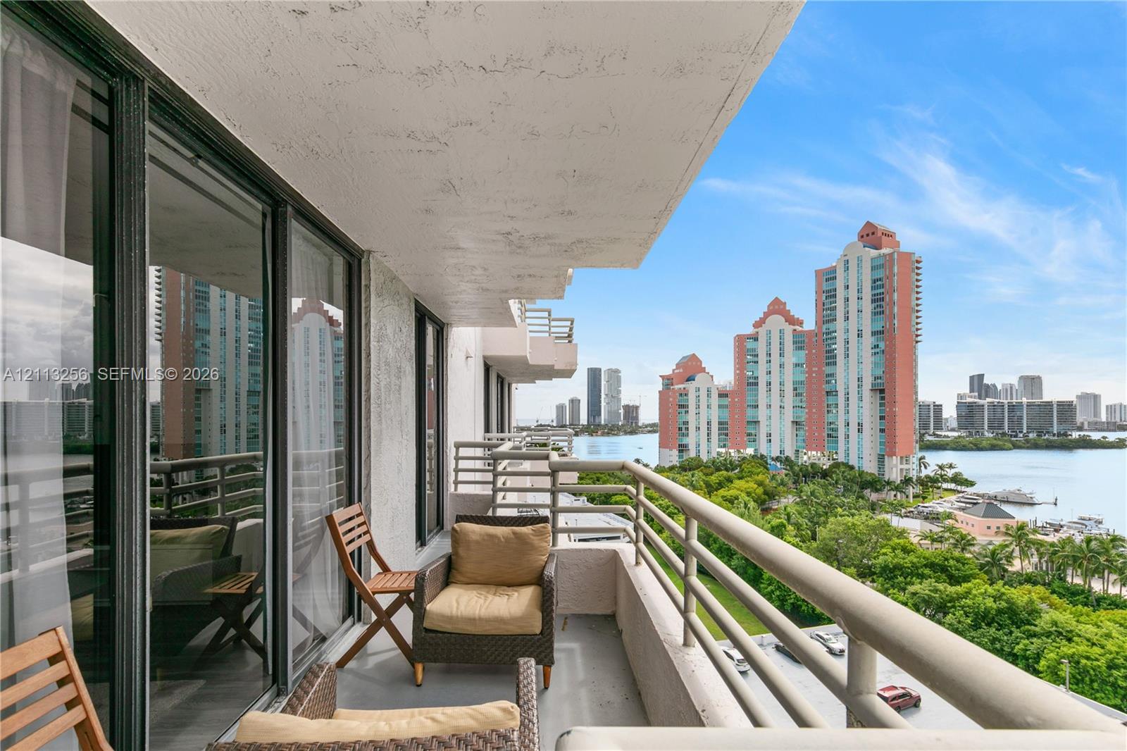 Covered oversized balcony featuring expansive ocean, cityscape and intracoastal views