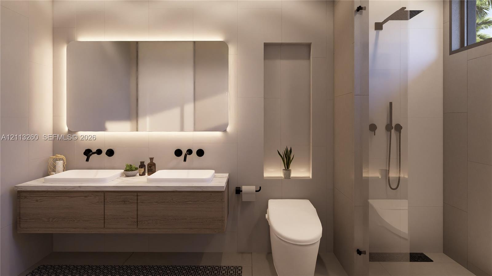 Floating dual-sink vanity with matte black wall-mounted faucets, large LED-backlit mirror, recessed wall niche, and glass-enclosed shower with matte black rainfall showerhead