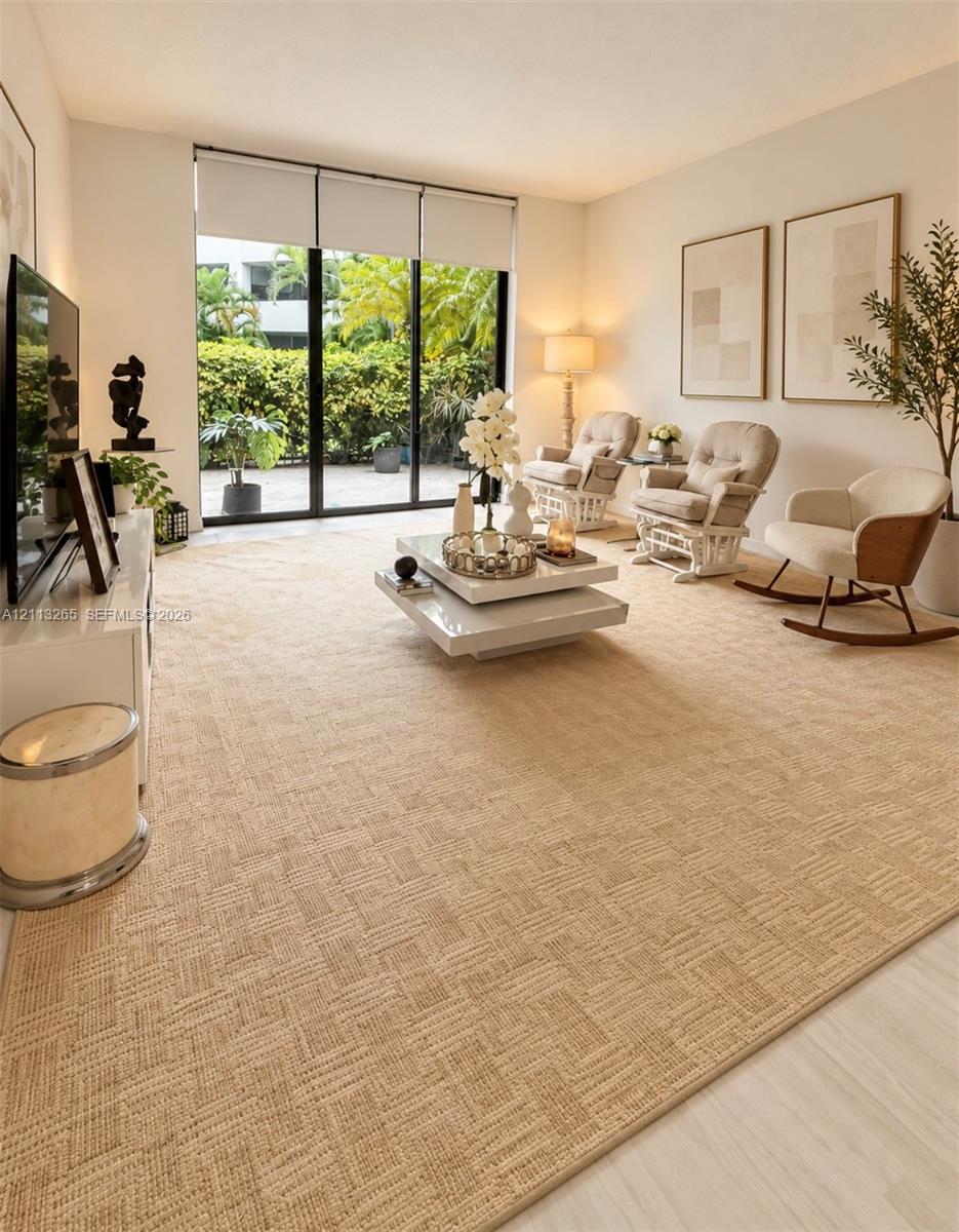 Wood-finish flooring, recessed ceiling lighting, and a multi-bulb track light fixture Wood-finish flooring, recessed ceiling lighting, and a multi-bulb track light fixture