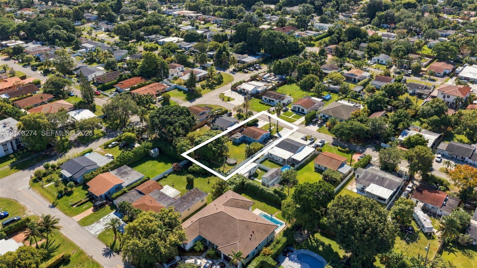 Aerial perspective featuring a rectangular lot, mature trees, and an established residential neighborhood Aerial perspective featuring a rectangular lot, mature trees, and an established residential neighborhood