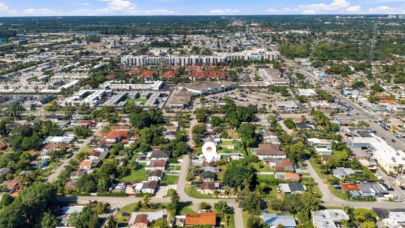 Aerial perspective featuring a residential lot with mature trees and a structured street grid Aerial perspective featuring a residential lot with mature trees and a structured street grid