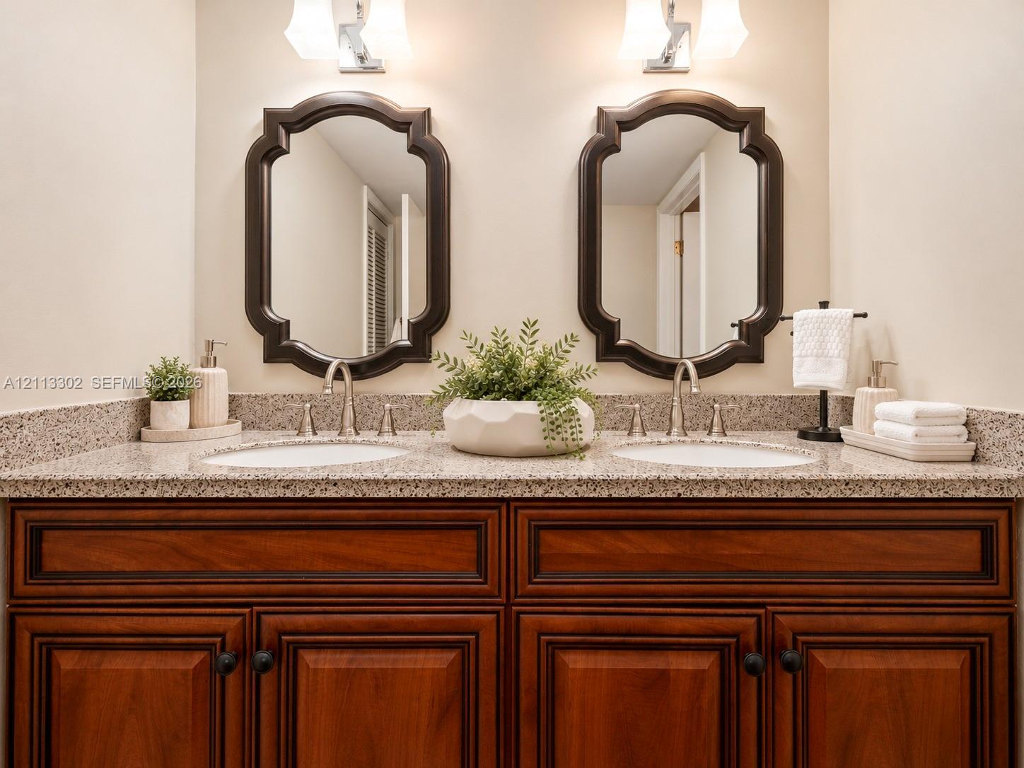 Primary Bathroom Dual-vanity cabinet stone countertop with wood-finish