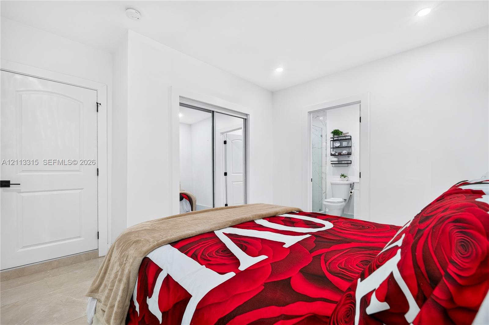 Interior featuring neutral wall coloring, recessed lighting, mirrored sliding closet doors, and hard-surface flooring