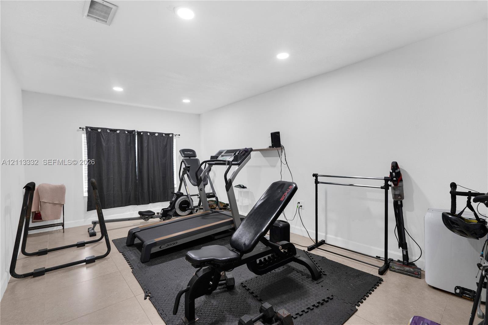 Room featuring tile flooring and recessed lighting