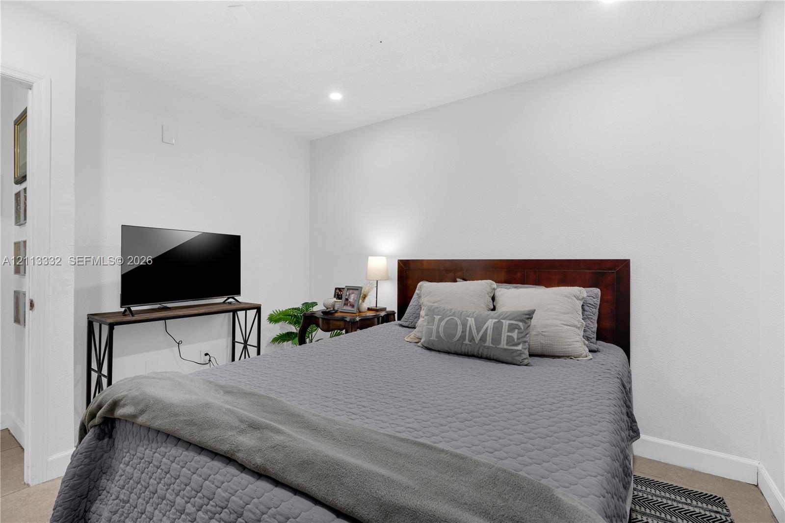 Neutral interior room featuring recessed lighting, smooth wall finishes, and carpeted flooring