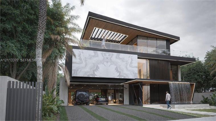 Contemporary multi-level exterior featuring a stone-clad facade, a covered ground-level parking area, a glass-railed upper terrace with a wood-paneled ceiling, and a built-in water feature
