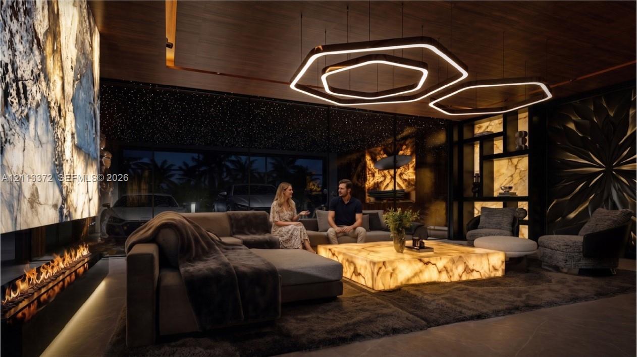 Expansive interior space featuring a floor-to-ceiling backlit stone wall, modern linear fireplace, hexagonal LED pendant lighting, and custom built-in shelving with integrated illumination