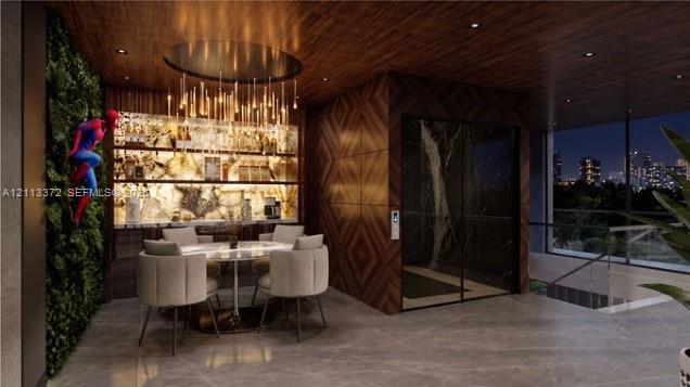 Wood-paneled ceilings, integrated backlighting, vertical interior garden wall, floor-to-ceiling glass enclosure, and stone-finish flooring