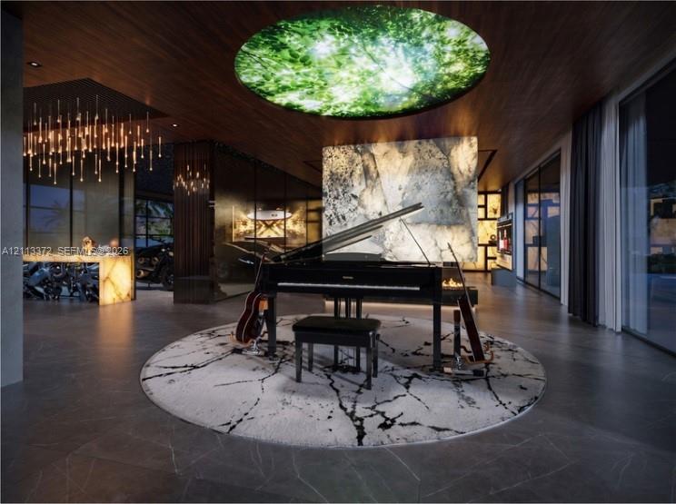 Large-format tile flooring, wood-paneled ceiling, integrated circular illuminated ceiling feature, and backlit stone accent wall