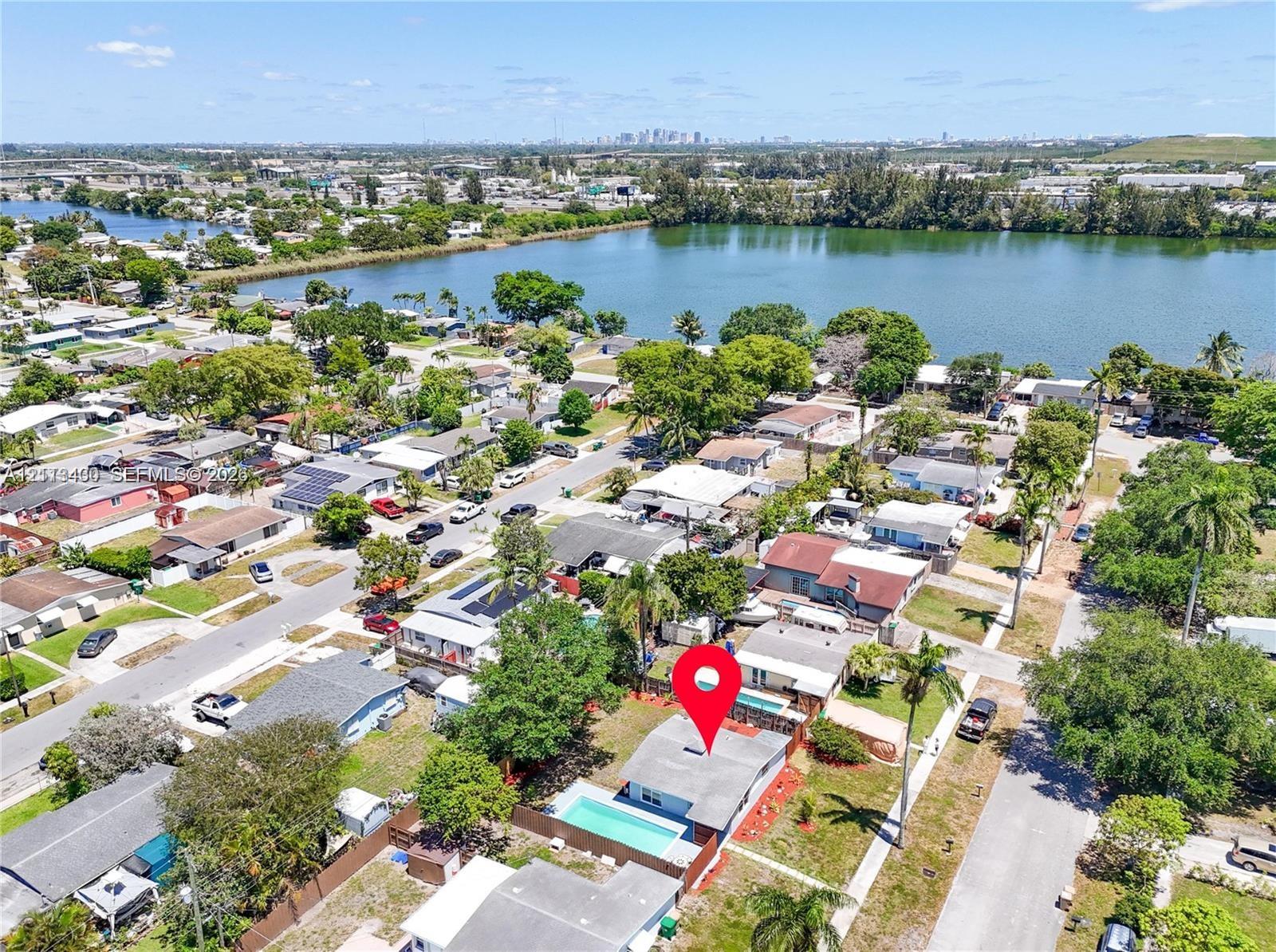Single-story residence featuring an in-ground swimming pool, fenced perimeter, and established landscaping Single-story residence featuring an in-ground swimming pool, fenced perimeter, and established landscaping