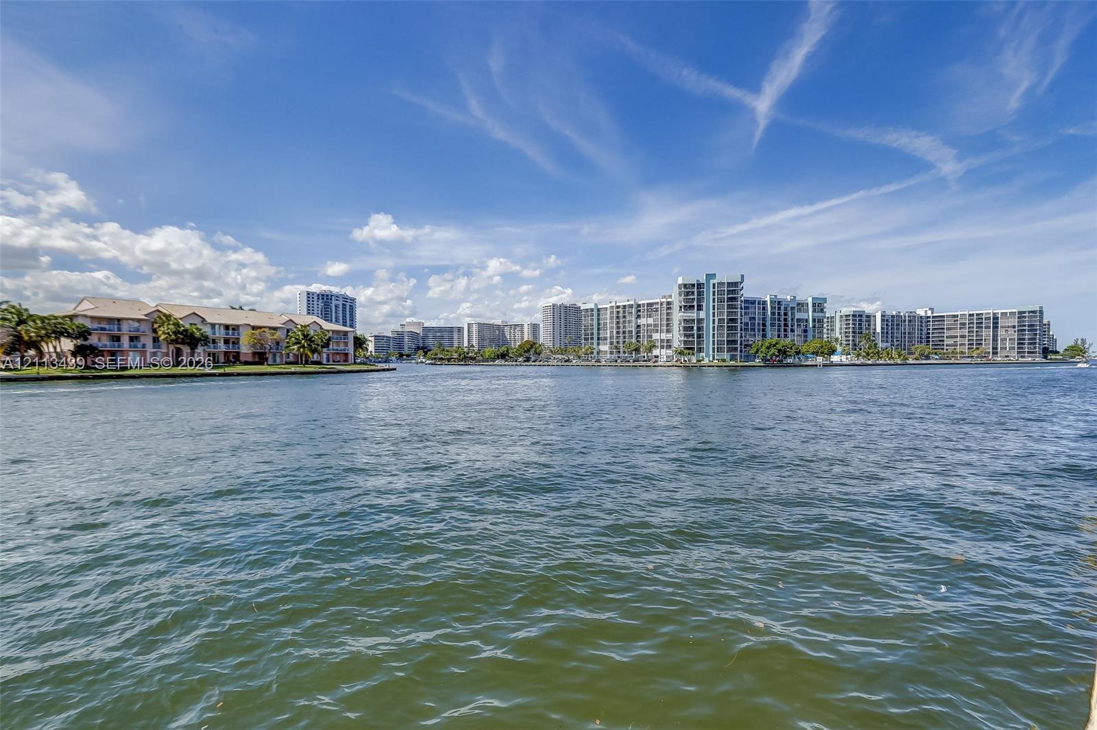 Waterfront setting featuring expansive canal frontage and mid-rise coastal architecture