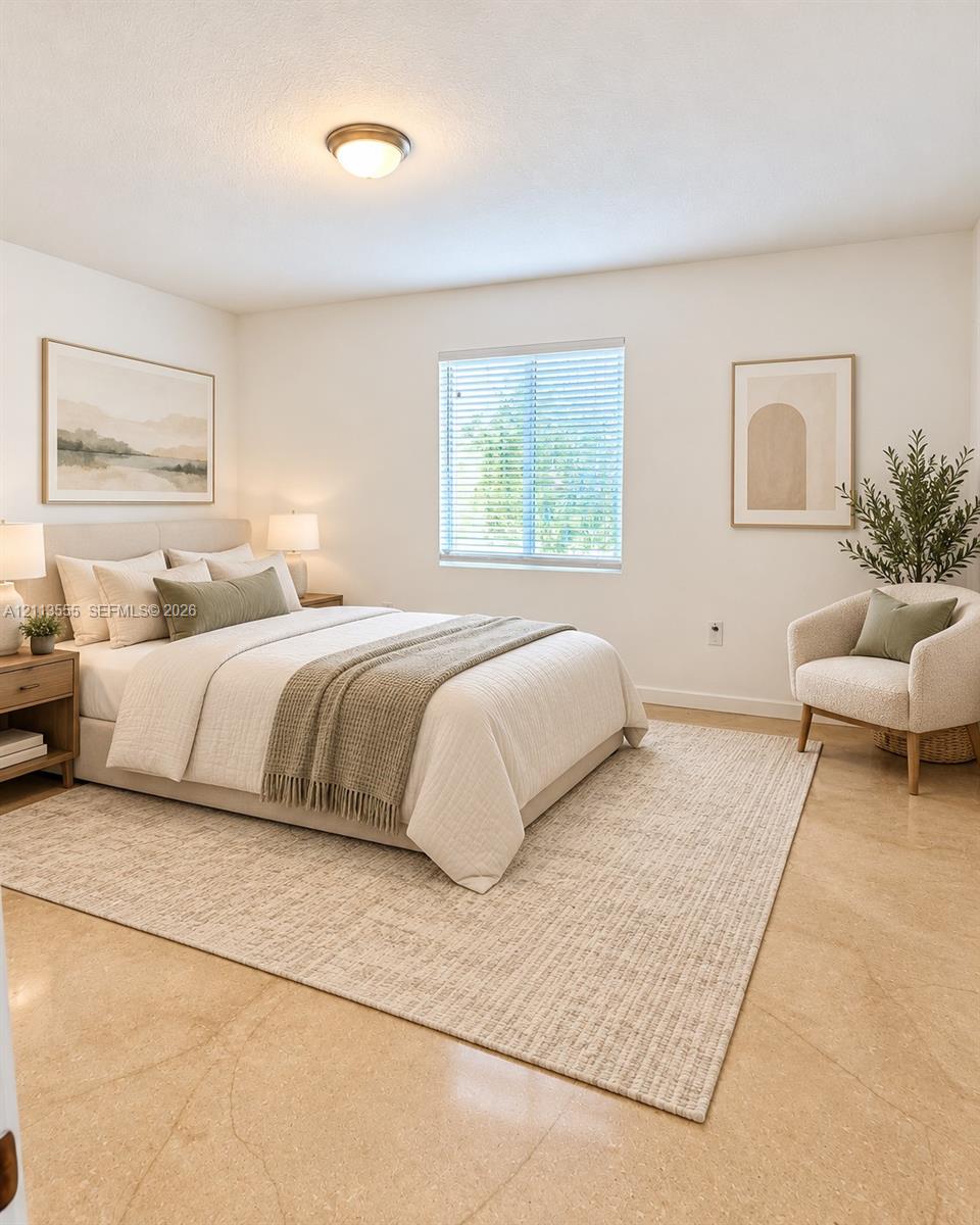 Polished concrete flooring, recessed ceiling lighting, and a window with horizontal blinds