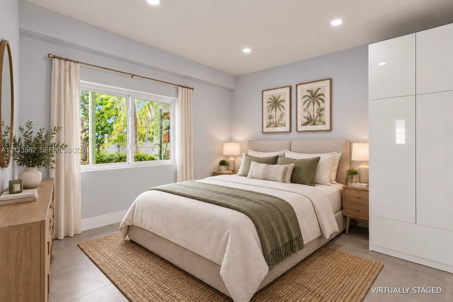 Bedroom featuring recessed lighting, a horizontal sliding window, and floor-to-ceiling white built-in cabinetry