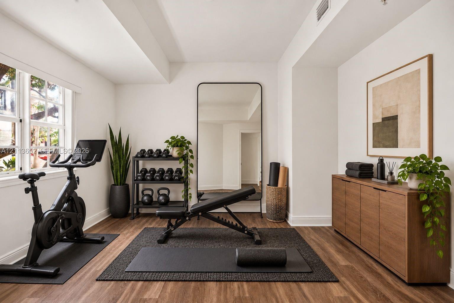 Multipurpose room featuring wood-finish flooring, multi-pane windows, and a built-in recessed ceiling light fixture