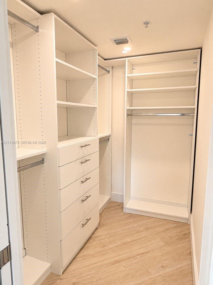 primary bedroom walk-in closet
