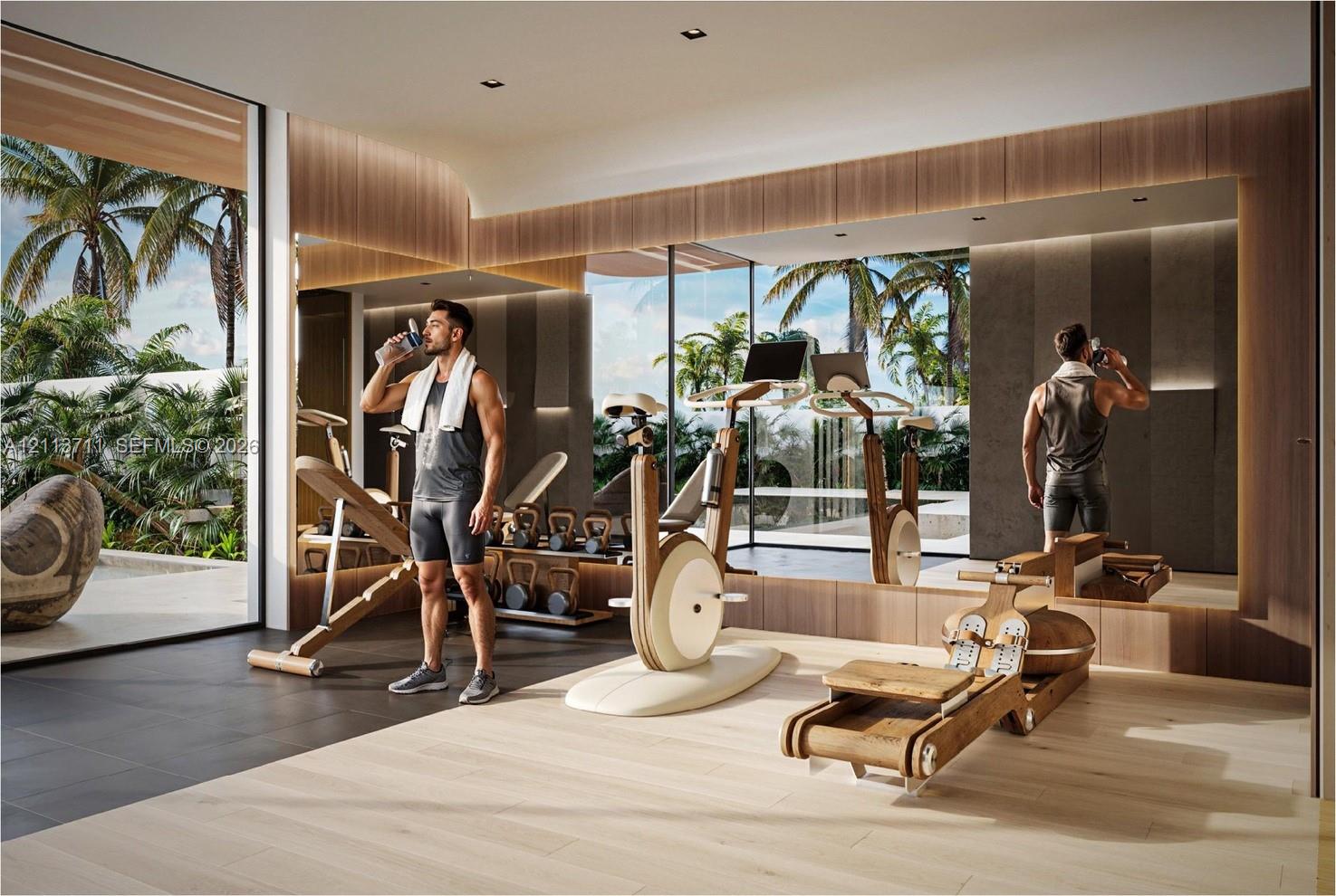 Floor-to-ceiling glass wall, light-toned wood-finish flooring, extensive wall-to-wall mirrors, recessed lighting, and integrated wood paneling