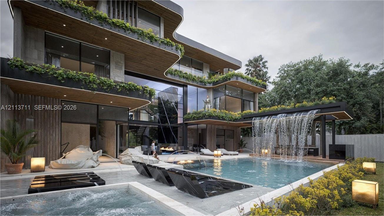 Contemporary multi-level exterior featuring floor-to-ceiling glass walls, integrated balcony greenery, a cascading water feature, a swimming pool with tiered hardscaping, and a built-in spa