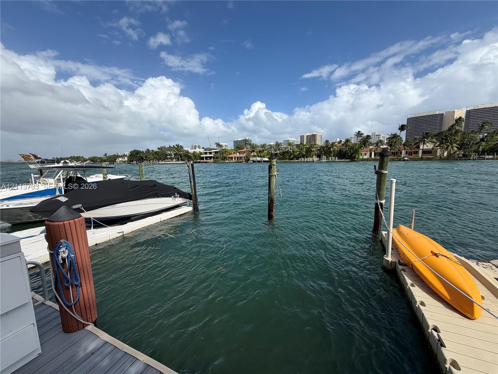 Waterfront property featuring a private floating dock system, multiple deep-water pilings, and direct bulkhead access