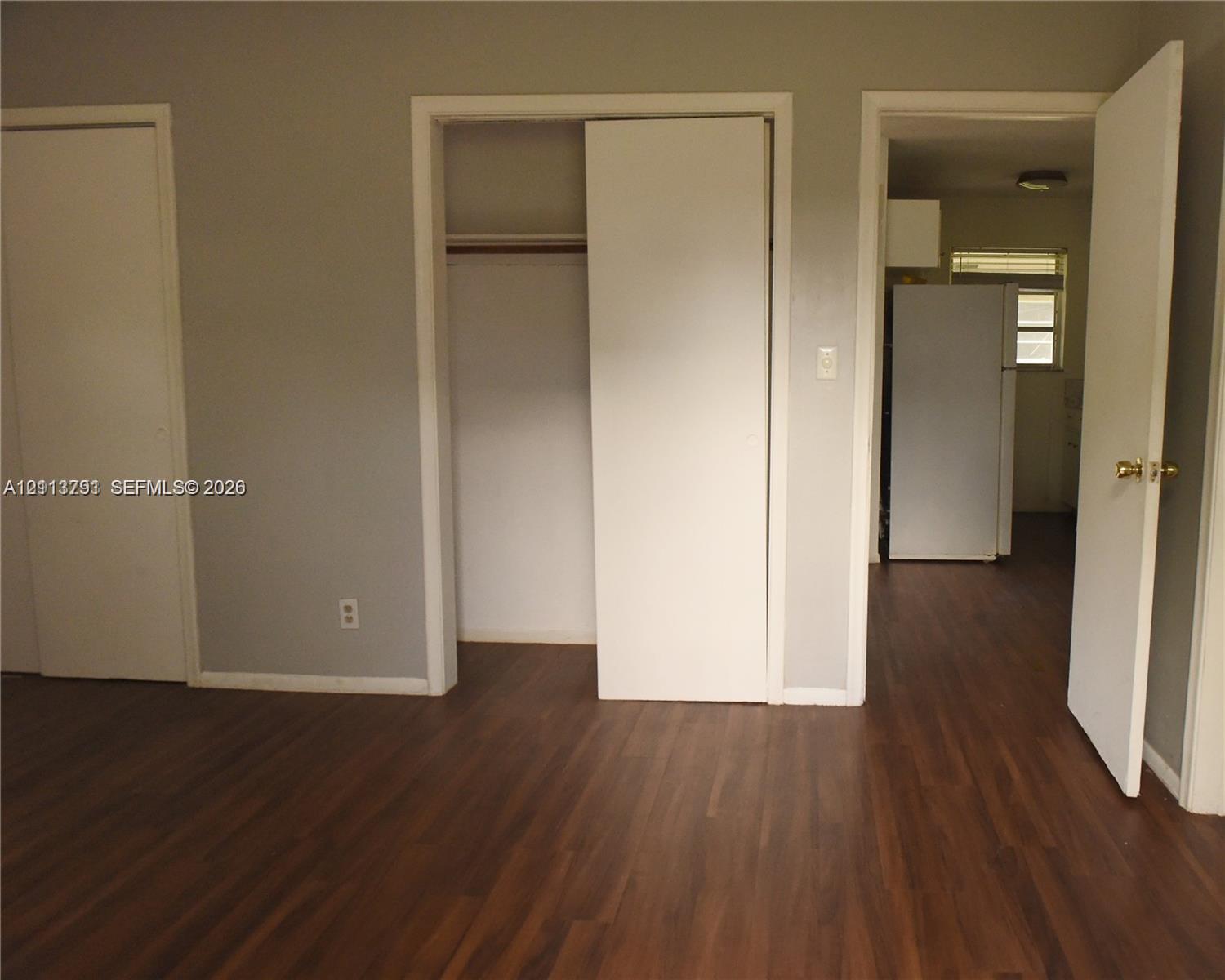 Wood-finish flooring, two sets of closet doors, and interior hinged passage door Wood-finish flooring, two sets of closet doors, and interior hinged passage door