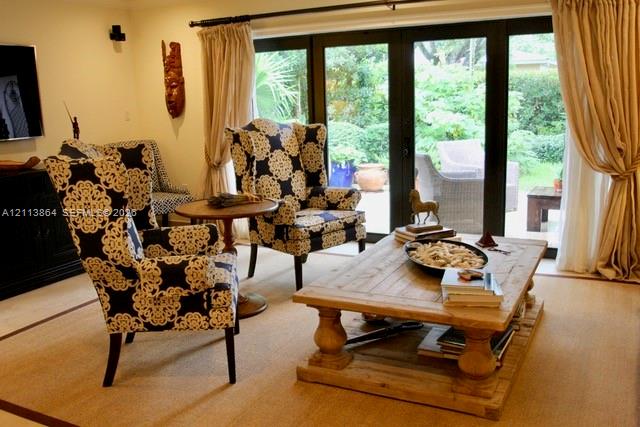 Black-framed multi-panel glass doors with patio access