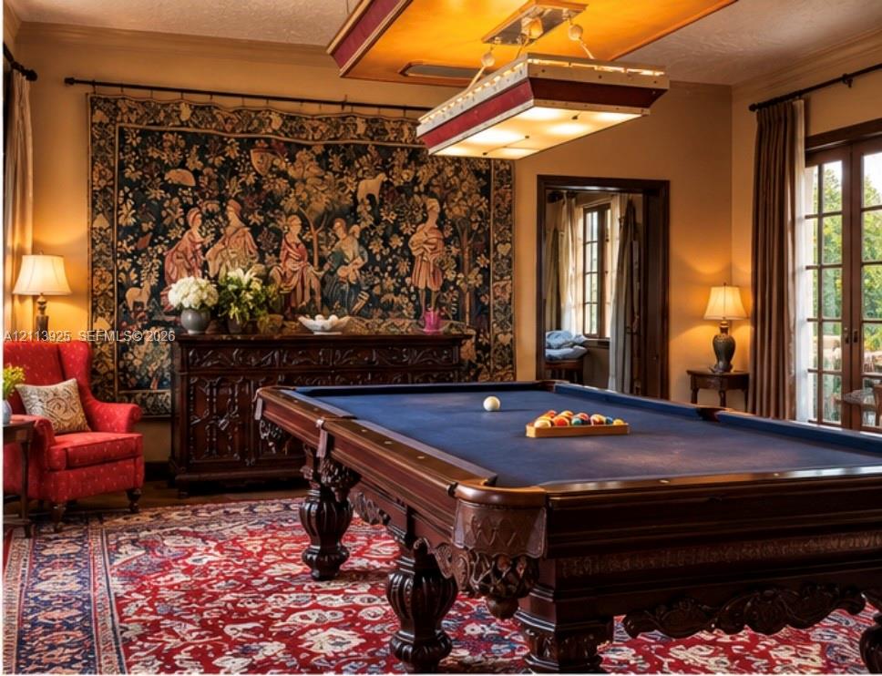 Custom rectangular billiard light fixture with a metallic frame, wood-trimmed French doors with glass panes, and crown molding