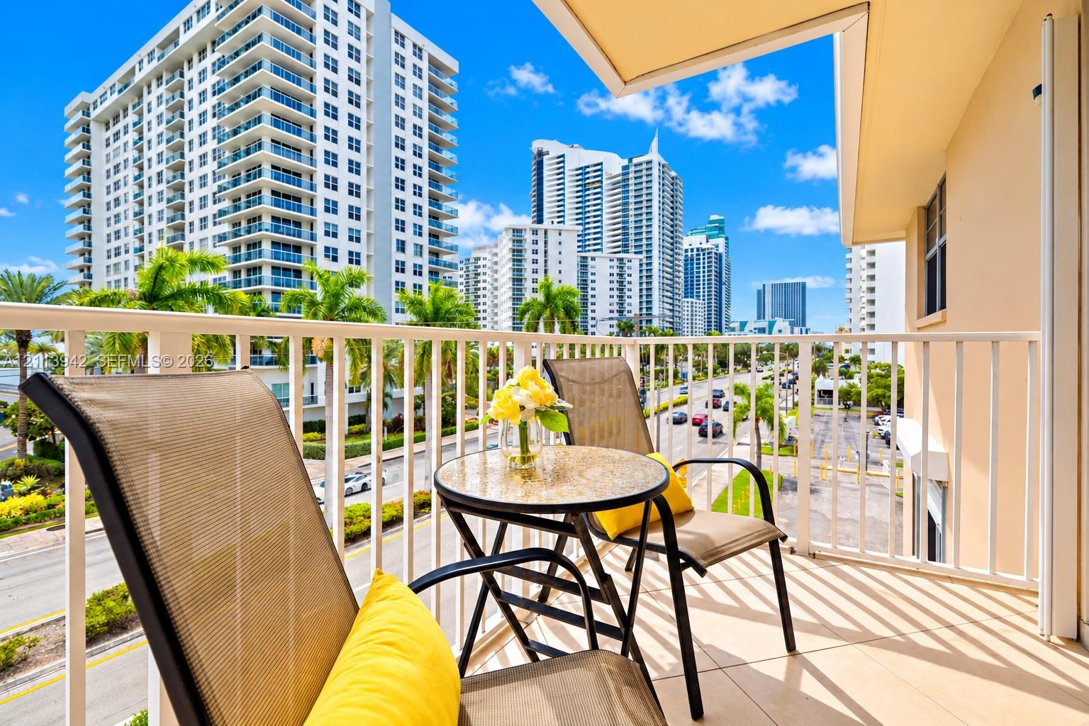 Private balcony featuring tile flooring and a white vertical railing