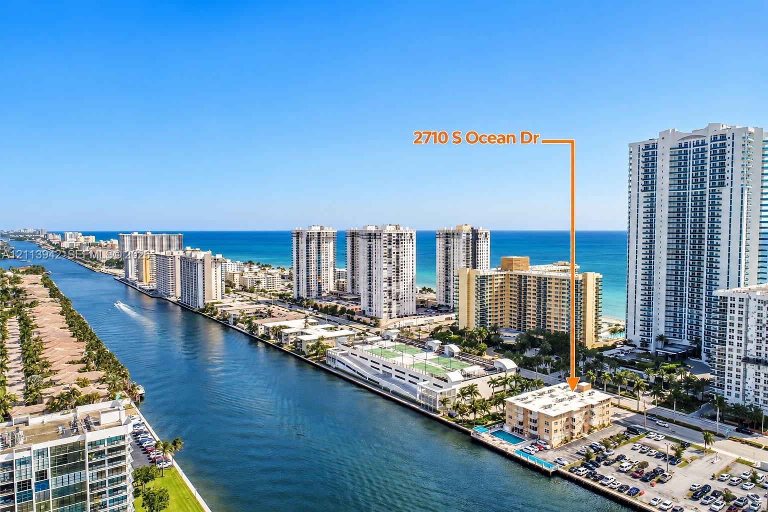 Waterfront property featuring a canal-side location, an outdoor swimming pool, and proximity to the coastline Waterfront property featuring a canal-side location, an outdoor swimming pool, and proximity to the coastline