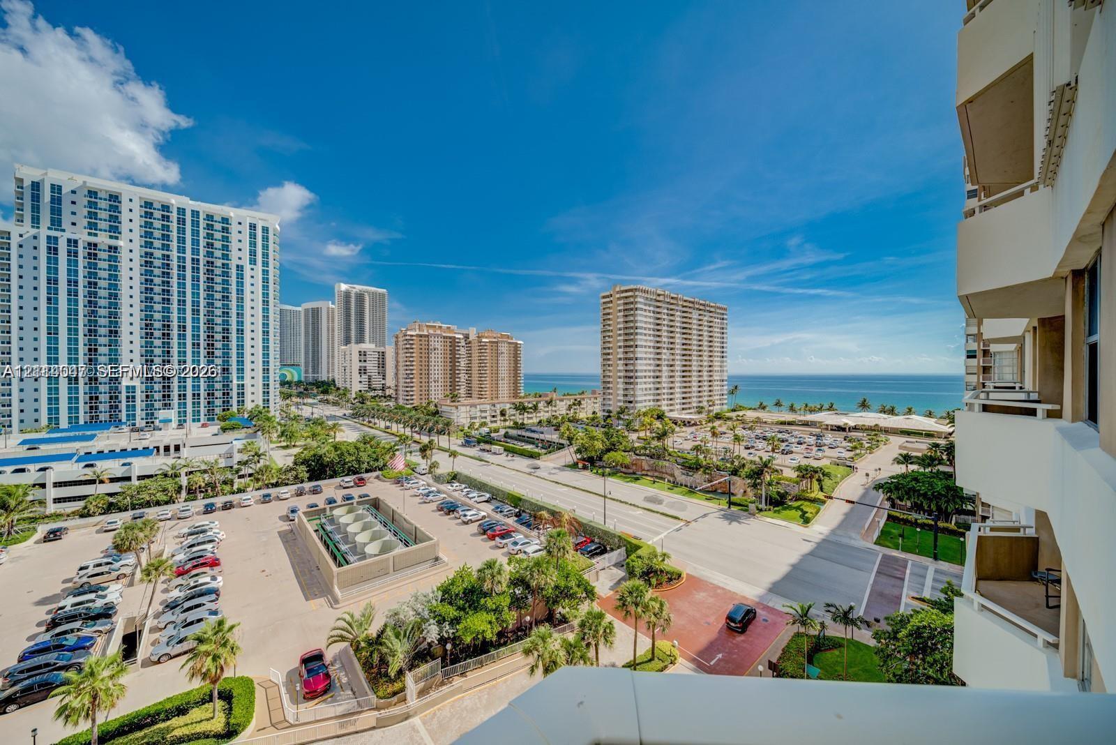 Elevated perspective featuring private cantilevered balconies and panoramic coastal scenery