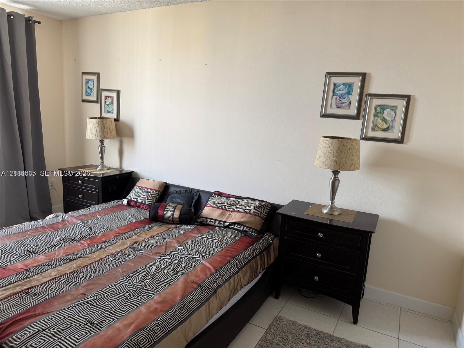 Neutral-toned walls paired with light-colored tile flooring